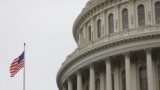 The U.S. Capitol during a morning rainstorm, after Congress agreed to a multi-trillion dollar economic stimulus package created in response to the economic fallout from the COVID-19 Coronavirus, on Capitol Hill in Washington, March 25, 2020.