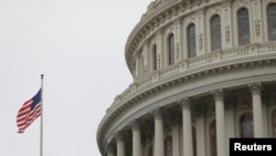 The U.S. Capitol during a morning rainstorm, after Congress agreed to a multi-trillion dollar economic stimulus package created in response to the economic fallout from the COVID-19 Coronavirus, on Capitol Hill in Washington, March 25, 2020.