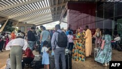FILE - Citizens of European countries are seen outside the Diori Hamani International Airport in Niamey on August 2, 2023. 
