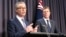 FILE - Australian Government Leader in the House of Representatives Christopher Pyne, left, and Attorney-General Christian Porter address reporters in Parliament House in Canberra, May 9, 2018.