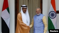 Sheikh Mohammed bin Zayed al-Nahyan, Crown Prince of Abu Dhabi and UAE's deputy commander-in-chief of the armed forces shakes hands with India's Prime Minister Narendra Modi (R) ahead of their meeting at Hyderabad House in New Delhi, India, January 25, 2017. REUTERS/Adnan Abidi