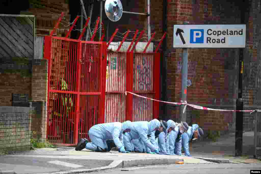 Forensic officers work at the area after Sasha Johnson, a Black Lives Matter activist, was shot in an early morning attack near her home in Peckham, London.