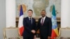 Ethiopia's Prime Minister Abiy Ahmed, right, shakes hands with France's President Emmanuel Macron at the newly renovated Ethiopia's historic National Palace in Addis Ababa on Dec. 21, 2024, as part of a two-day visit to Djibouti and Ethiopia. 