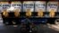 A man cycles past a truck of Corona beer produced by Group Modelo in Mexico City July 16, 2013. 