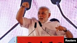 FILE - Indian Prime Minister Narendra Modi, campaigning ahead of state assembly elections, speaks at a rally in Mumbai, Oct. 9, 2014.