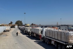 Trucks carrying humanitarian aid line up on the Egyptian side of the Rafah border crossing with the Gaza Strip on March 2, 2025, after Israel suspended the entry of supplies into the Palestinian enclave.