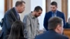 Hadi Matar, center, charged with severely injuring author Salman Rushdie in a 2022 knife attack, reacts after being found guilty on all counts in Chautauqua County court in Mayville, N.Y., Feb. 21, 2025.