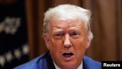 President Donald Trump speaks about Thursday's Supreme Court rulings, calling them "part of a political witch hunt and a hoax," during a round-table discussion with members of the Hispanic community at the White House in Washington, July 9, 2020.