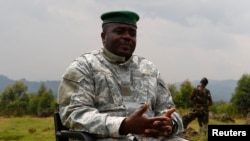 Congolese M23 rebel leader Bisimwa Bertrand speaks to the media in Bunagana, Aug. 2, 2013. 