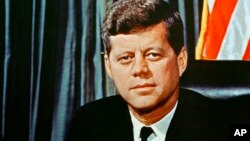 FILE - U.S President John F. Kennedy is seen in a 1963 portrait. The JFK Library Foundation has started tweeting in his name.