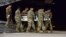 In this image provided by the U.S. Air Force, a U.S. Army carry team transfers the remains of Army Staff Sgt. Dustin Wright of Lyons, Georgia, Oct. 5, 2017, upon arrival at Dover Air Force Base, Delware. Four U.S. troops and four Niger forces killed in an ambush by dozens of Islamic extremists on a joint patrol of American and Niger Force. 