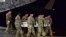 In this image provided by the U.S. Air Force, a U.S. Army carry team transfers the remains of Army Staff Sgt. Dustin Wright of Lyons, Georgia, Oct. 5, 2017, upon arrival at Dover Air Force Base, Delware. Wright, 29, of Lyons, Ga., was one of four U.S. troops and four Niger forces killed in an ambush by dozens of extremists on a joint patrol of American and Niger Force. 
