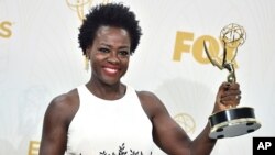 FILE - Viola Davis poses in the press room with the award for outstanding lead actress in a drama series for “How to Get Away With Murder” at the 67th Primetime Emmy Awards in Los Angeles, California, Sept. 20, 2015.