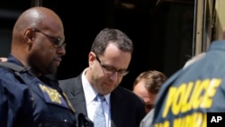 Former Subway pitchman Jared Fogle leaves the Federal Courthouse in Indianapolis, Aug. 19, 2015, following a hearing on child sex and porn charges.