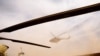 FILE - An Iraqi Army helicopter flies during a military operation against Islamic State militants in the desert of Anbar, Iraq, April 23, 2022. 