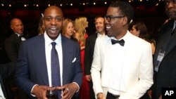 Dave Chappelle (l) and Chris Rock appear backstage at the Oscars, Feb. 28, 2016, at the Dolby Theatre in Los Angeles. 