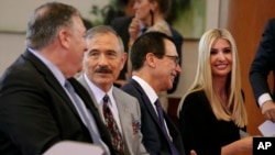 FILE - Sec. of State Mike Pompeo, left, U.S. Ambassador to South Korea Harry Harris, chat before a news conference by President Donald Trump and South Korean President Moon Jae-in in Seoul, South Korea, June 30, 2019.