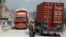 U.S. soldier watches trucks crossing Torkham gate border between Afghanistan and Pakistan in Nangarhar province, Afghanistan, July 21, 2011.