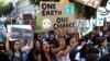 Activists march in a climate change rally in London, Britain, Sept. 20, 2019.