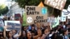 Activists march in a climate change rally in London, Britain, Sept. 20, 2019.