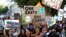 Activists march in a climate change rally in London, Britain, Sept. 20, 2019.