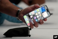 FILE - The iPhone 15 Pro is shown after its introduction on the Apple campus, Sept. 12, 2023, in Cupertino, California. (AP Photo/Jeff Chiu, File)