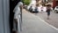 FILE - A nun looks out as the the annual LGBT parade files past, in Asuncion, Paraguay, Sept. 30, 2017. 