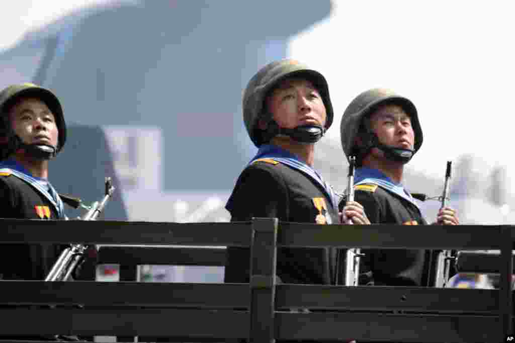 North Korean soldiers ride a military vehicle during the parade. (Sungwon Baik/VOA)