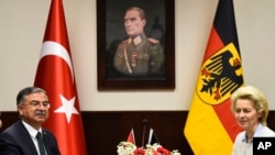 On Jan. 21, 2016, German defense minister Ursula von der Leyen, right, and Turkish Defense Minister Ismet Yilmaz, pose for a photograph before their meeting at the air base in Incirlik, Turkey.