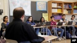 Stuart Wexler leads his Advanced Placement government class in a discussion at Hightstown High School in Hightstown, N.J., Tuesday, Feb. 19, 2019. 