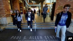 FILE - Students walk out of the Paul G. Allen School of Computer Science & Engineering at the University of Washington in Seattle.
