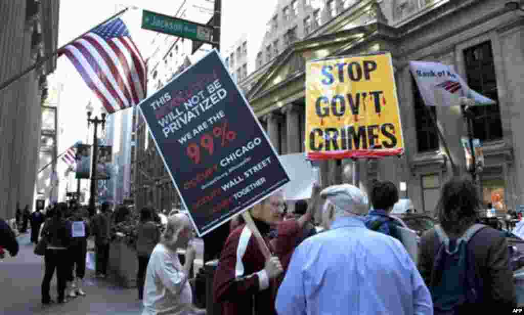Protesters gather on the corner of LaSalle and Jackson during an Occupy Chicago protest Monday, Oct. 3, 2011, in Chicago. "Occupy Chicago" protests started Monday near the Federal Reserve Bank and Chicago Board of Trade, as demonstrators speak out against