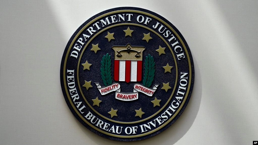 FILE - An FBI seal is seen on a wall on Aug. 10, 2022, in Omaha, Neb. Violent crime in the US ｄropped again in 2023, according to FBI statistics. (AP Photo/Charlie Neibergall, File)