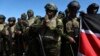 Kenyan police, who are part of a UN-backed multinational force, pray on the tarmac after landing at the Toussaint Louverture International Airport in Port-au-Prince, Haiti, Feb. 6, 2025. 