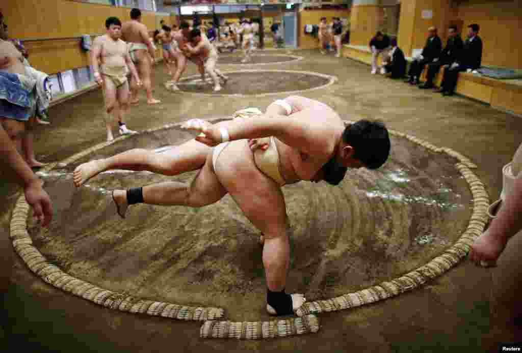 College students work out at the Sumo wrestling club at Nippon Sports Science University in Tokyo, Japan.