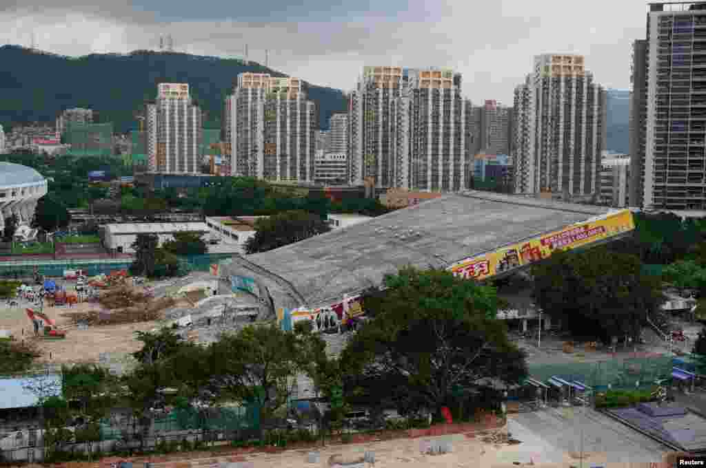 Rescue workers are seen at the scene of a collapsed sports stadium in Shenzhen, Guangdong province, China.