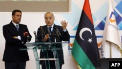 U.N. Special Representative and Head of the U.N. Support Mission in Libya (UNSMIL) Ghassan Salame, right, speaks at a press conference with Emad al-Sayh, the Chairman of the Libyan Electoral Commission in the capital Tripoli, Dec. 6, 2017, during which the commission announced announced the start of the voter registration process and the updating of the electoral register.