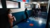 Los Angeles Unified School District students stand in a hallway socially distance during a lunch break at Boys & Girls Club of Hollywood in Los Angeles, Aug. 26, 2020.