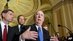 Senate Minority Leader Mitch McConnell speaks with reporters on Capitol in Washington, Nov. 27, 2012.