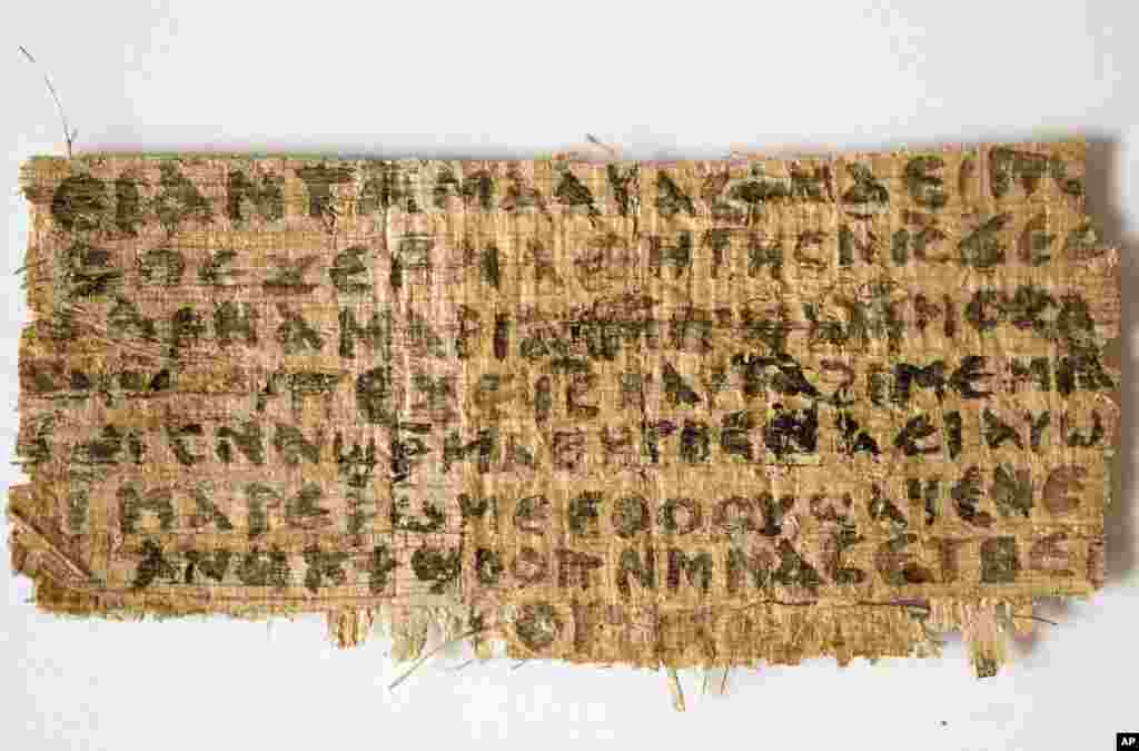 This photo released by Harvard University shows a Fourth Century fragment of papyrus that divinity professor Karen L. King says is the only existing ancient text that quotes Jesus explicitly referring to having a wife. King, an expert in the history of C