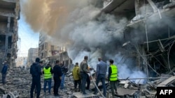 Firefighters douse a fire at the site of an Israeli airstrike in the Ghobeiry neighborhood of Beirut's southern suburbs on Nov. 15, 2024, amid the ongoing war between Israel and Hezbollah.