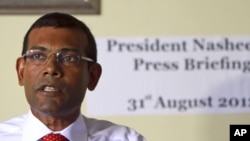 Former Maldives’ President Mohamed Nasheed speaks during a press conference after the commission of national inquiry released its report in Male, Maldives, which concluded that Nasheed's resignation was legal, and not forced at gunpoint as he claimed.
