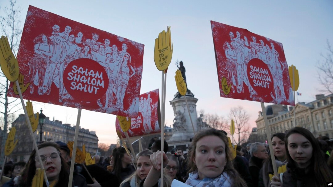 FILE - People take to the streets near Republique square to protest anti-Semitism, in Paris, France, Feb. 19, 2019. 