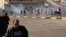 Protesters run from tear gas fired by security forces, during a demonstration by followers of Iraq's influential Shi'ite cleric Muqtada al-Sadr, in Baghdad, Iraq, Feb. 11, 2017.