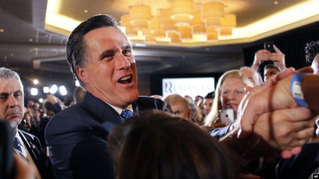 Republican presidential candidate, former Massachusetts Gov. Mitt Romney, greet supporters at his Super Tuesday primary night rally in Boston, Tuesday, March 6, 2012. 