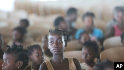 A young girl at a temporary shelter for children in Pemba city, on the northeastern coast of Mozambique, May 2, 2019.