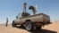 FILE - Libyan forces allied with the U.N.-backed government patrol to prevent Islamic State resurgence on the outskirts of Sirte, Libya, Aug. 4, 2017. 