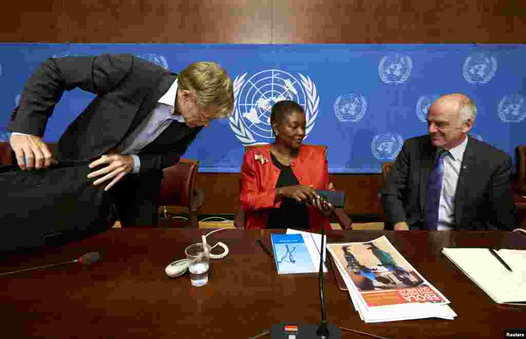 U.N. humanitarian chief Valerie Amos, center, speaks with World Health Organization Assistant Director General Bruce Aylward, left, and Dr. David Nabarro, senior U.N. coordinator for Ebola, after a news conference on Ebola at the United Nations in Geneva, Switzerland, Sept. 16, 2014.