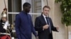 FILE - Senegalese President Bassirou Diomaye Faye and French President Emmanuel Macron leave the Elysee Palace after a lunch in Paris on June 20, 2024. Senegal is one of several African nations that have asked France to withdraw its troops from their territory.