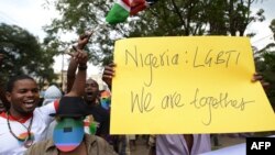 FILE - Kenyan gay and lesbian organizations demonstrate outside the Nigerian High Commission in Nairobi, Feb. 7, 2014. Nigerian President Goodluck Jonathan in 2013 signed a bill into law against gay marriage and civil partnerships.